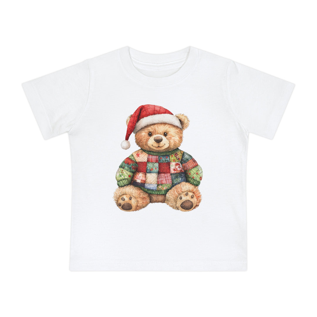 Christmas Bear Baby Tee: A white cotton t-shirt featuring a teddy bear with a Santa hat and patchwork sweater, designed for baby comfort and durability.