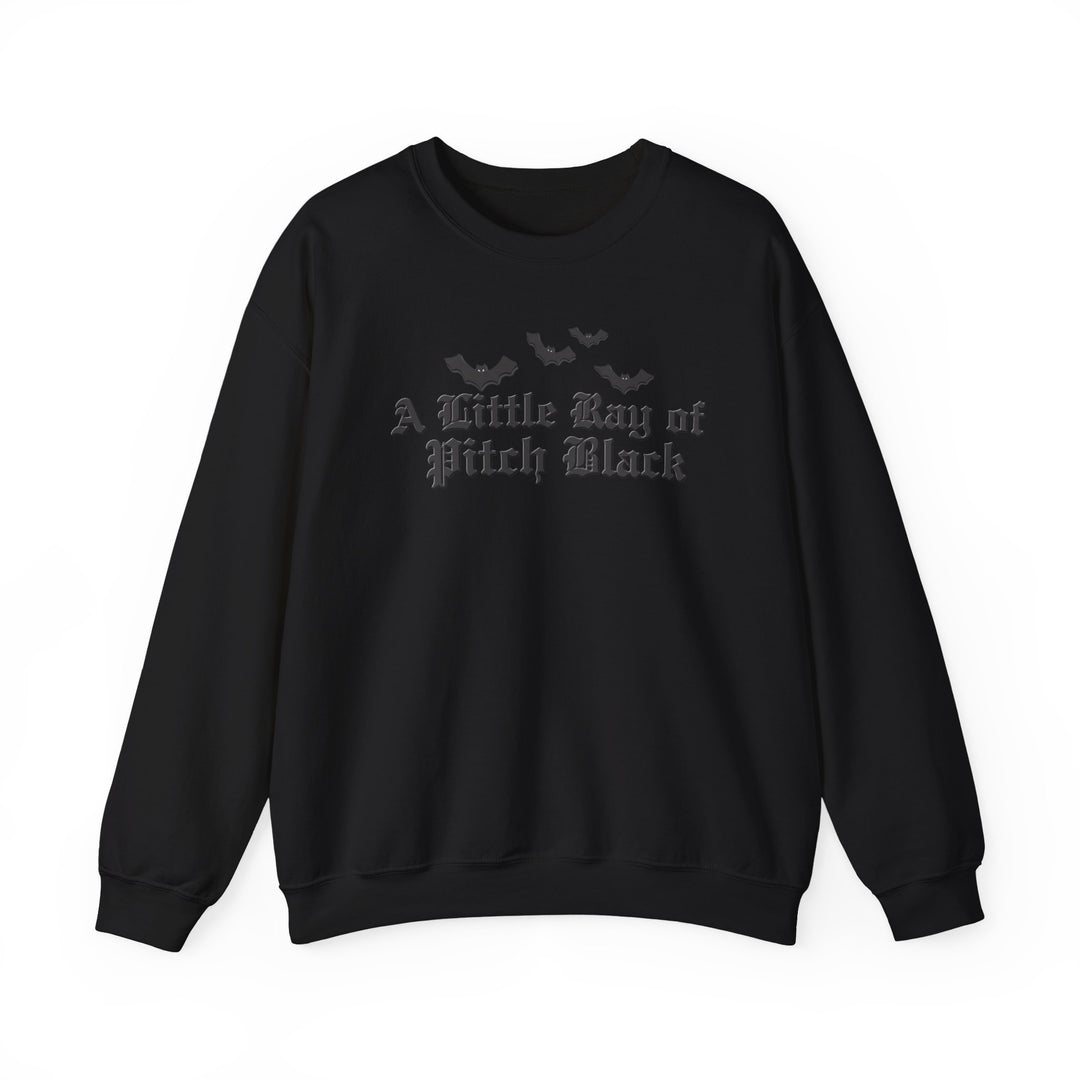 Black crewneck sweatshirt with A Little Ray of Pitch Black in old-English font and bat silhouettes, embodying a minimalist gothic style.