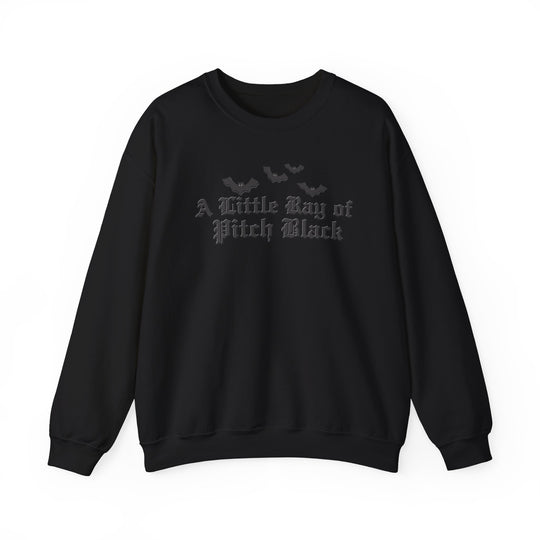 Black crewneck sweatshirt with A Little Ray of Pitch Black in old-English font and bat silhouettes, embodying a minimalist gothic style.