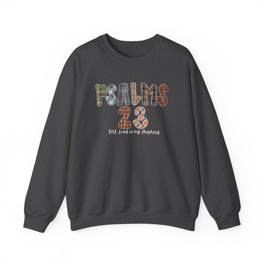 Dark charcoal-gray crewneck sweatshirt featuring PSALMS 23 in multicolored plaid letters, with cursive text below reading The Lord is my shepherd.