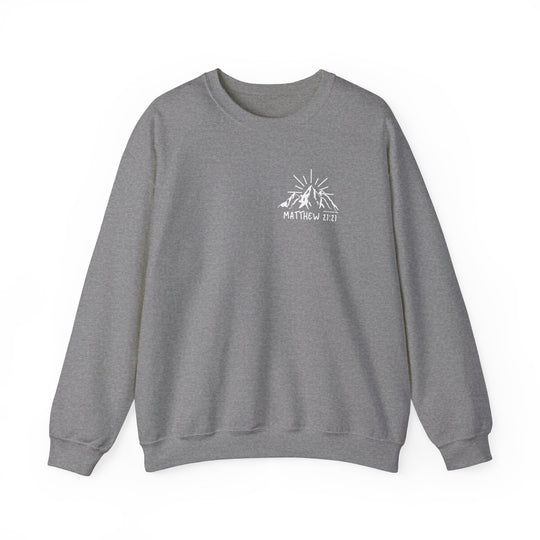 Unisex heavy blend crewneck sweatshirt featuring a mountain and sun logo. Made from 50% cotton, 50% polyester for comfort and durability. Classic fit with ribbed knit collar and double-needle stitching. Ethically made in the US.