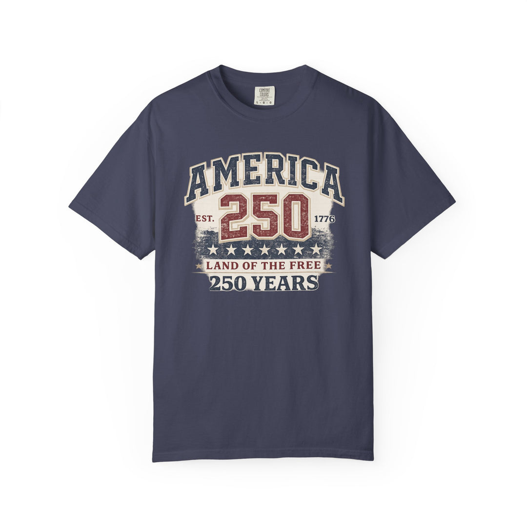 Navy-blue America 250 Years Tee with distressed, patriotic print commemorating the USA's founding, featuring stars and slogans. Made from soft, durable, 100% cotton.