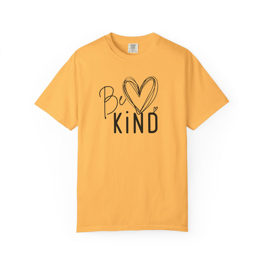 Be Kind Tee features a golden-yellow short-sleeve shirt with Be ♥ KiND in a stylish black font, offering a relaxed fit and soft fabric.