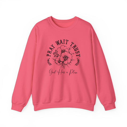 Pray Wait Trust Crew sweatshirt featuring a pink backdrop with black floral design, crafted from a comfortable polyester-cotton blend, ideal for casual wear.