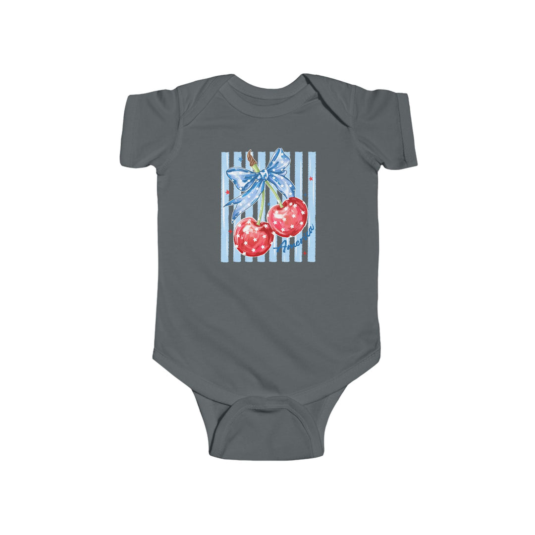 American Cherry Onesie: Charcoal-gray infant bodysuit featuring Americana-style cherries with a blue bow and stars, perfect for comfort and style in 100% cotton.
