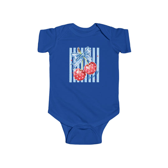 American Cherry Onesie: Cobalt-blue baby bodysuit featuring red cherries with stars and a bow, offering soft, durable cotton comfort and easy snaps for changing.