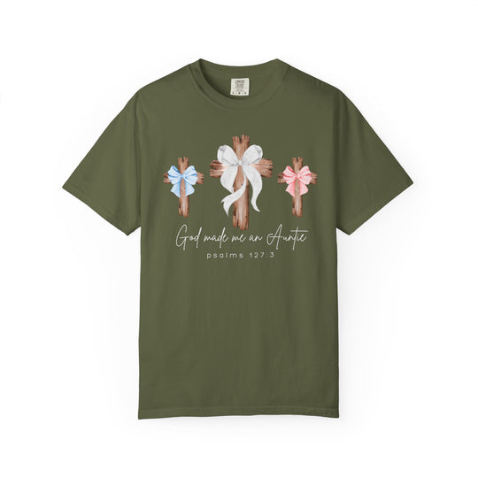 Olive-green tee featuring three wooden crosses with bows and “God made me an Auntie” text, emphasizes faith and family. Comfortable, durable, and ideal for everyday wear.