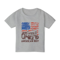 American Boy Toddler Tee features a heather-gray design with a distressed American flag and vintage tractor illustration, ensuring style and comfort for toddlers.