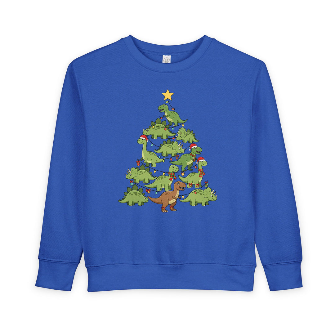 Dino Tree Toddler Crew: A royal-blue sweatshirt featuring a playful dinosaur Christmas tree design with dinos in Santa hats and lights, perfect for cozy toddler wear.