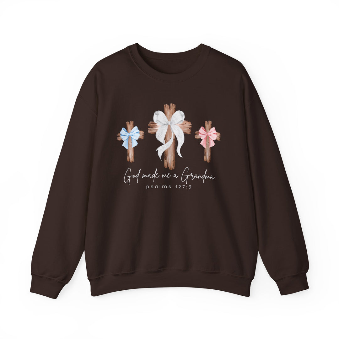 Dark-brown sweatshirt featuring three wooden crosses with bows and the phrase “God made me a Grandma, Psalms 127:3.” Ideal comfort blend.