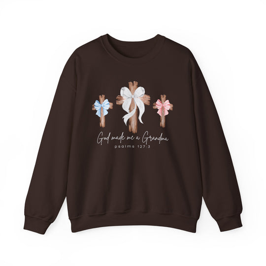 Dark-brown sweatshirt featuring three wooden crosses with bows and the phrase “God made me a Grandma, Psalms 127:3.” Ideal comfort blend.