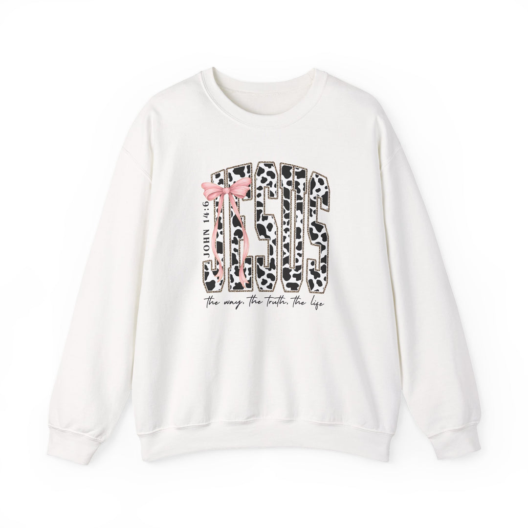 John 14:6 Crew: White crewneck sweatshirt with JESUS in cow-spot pattern, gold outline, pink bow, and script text The way. The truth. The life.