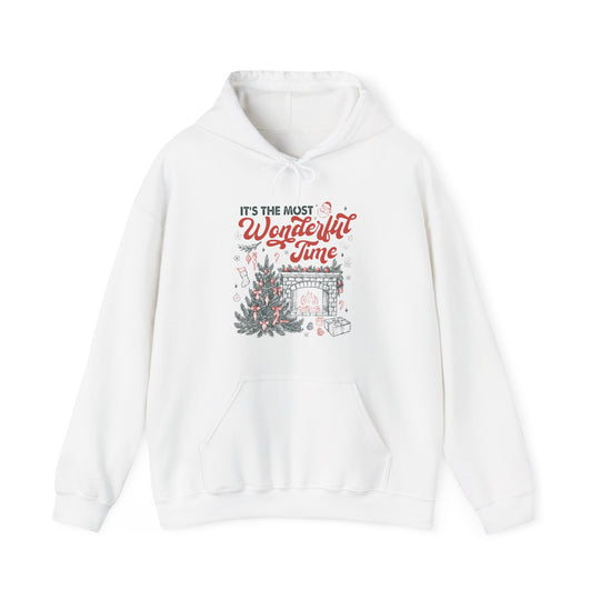Most Wonderful Time of the Year Hoodie with festive scene, featuring Christmas tree, fireplace, and gifts, perfect for cozy holiday warmth and style.