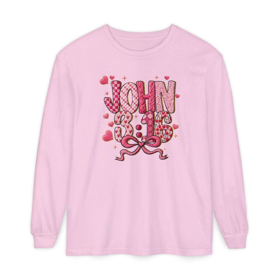 Light pink 3:16 Long Sleeve Tee with JOHN 3:16 graphic, featuring textured letters and pink patterns, surrounded by hearts and sparkles, offering comfort and style.