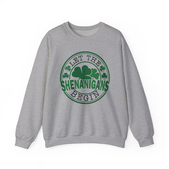 Grey sweatshirt featuring 'Let the Shenanigans Begin Day Crew' in green text, ideal for comfort and style with a ribbed collar and loose fit.