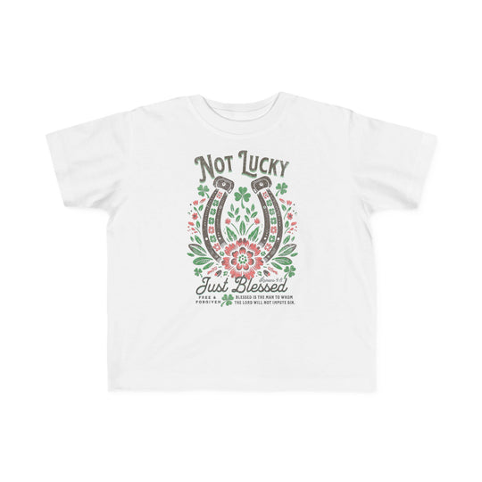Blessed Toddler's Tee: White t-shirt featuring a graphic design of a horseshoe and flowers, crafted for toddler comfort with soft, durable cotton.