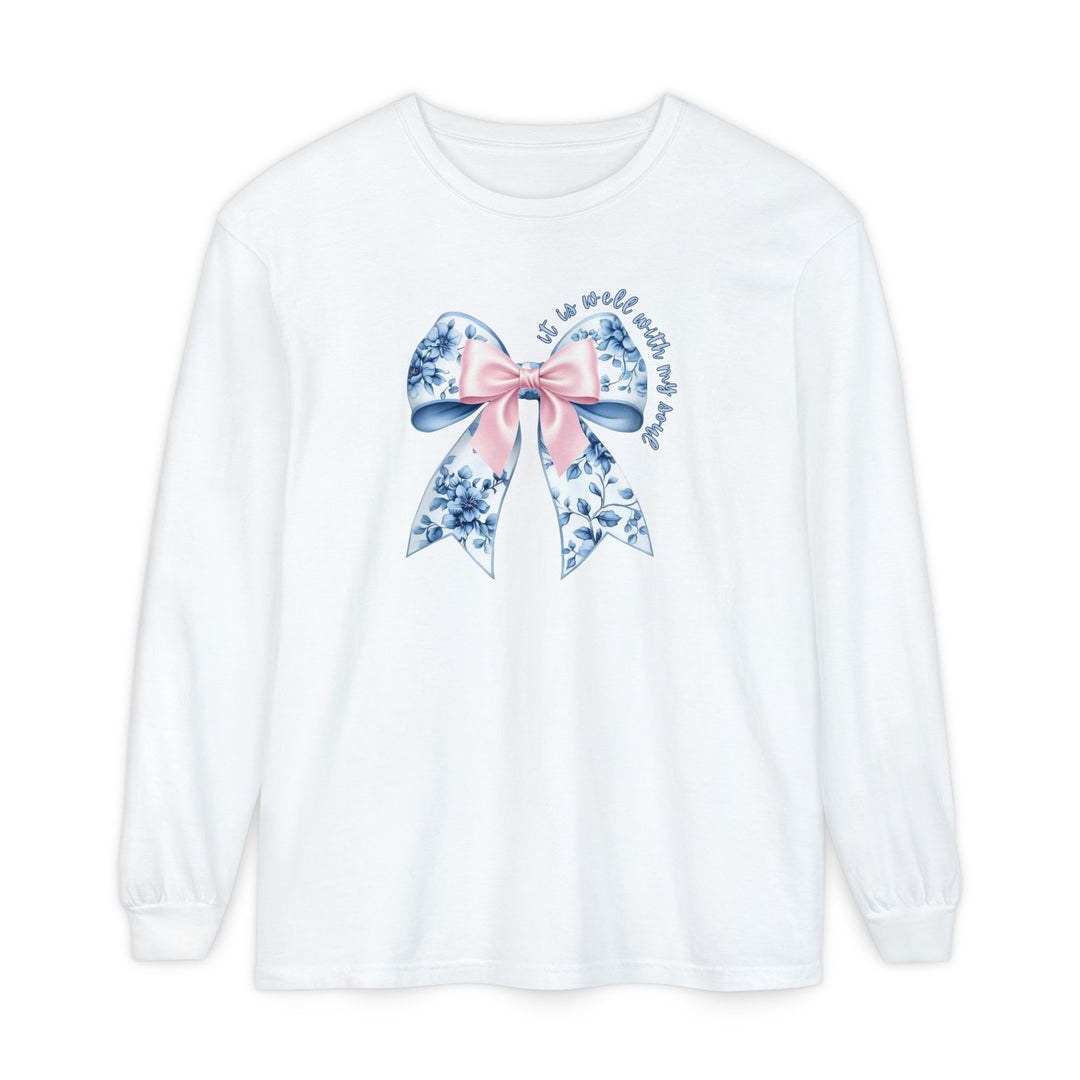 It is Well With My Soul Long Sleeve Tee featuring a large floral bow graphic and hand-lettered phrase, made of soft, 100% ring-spun cotton.