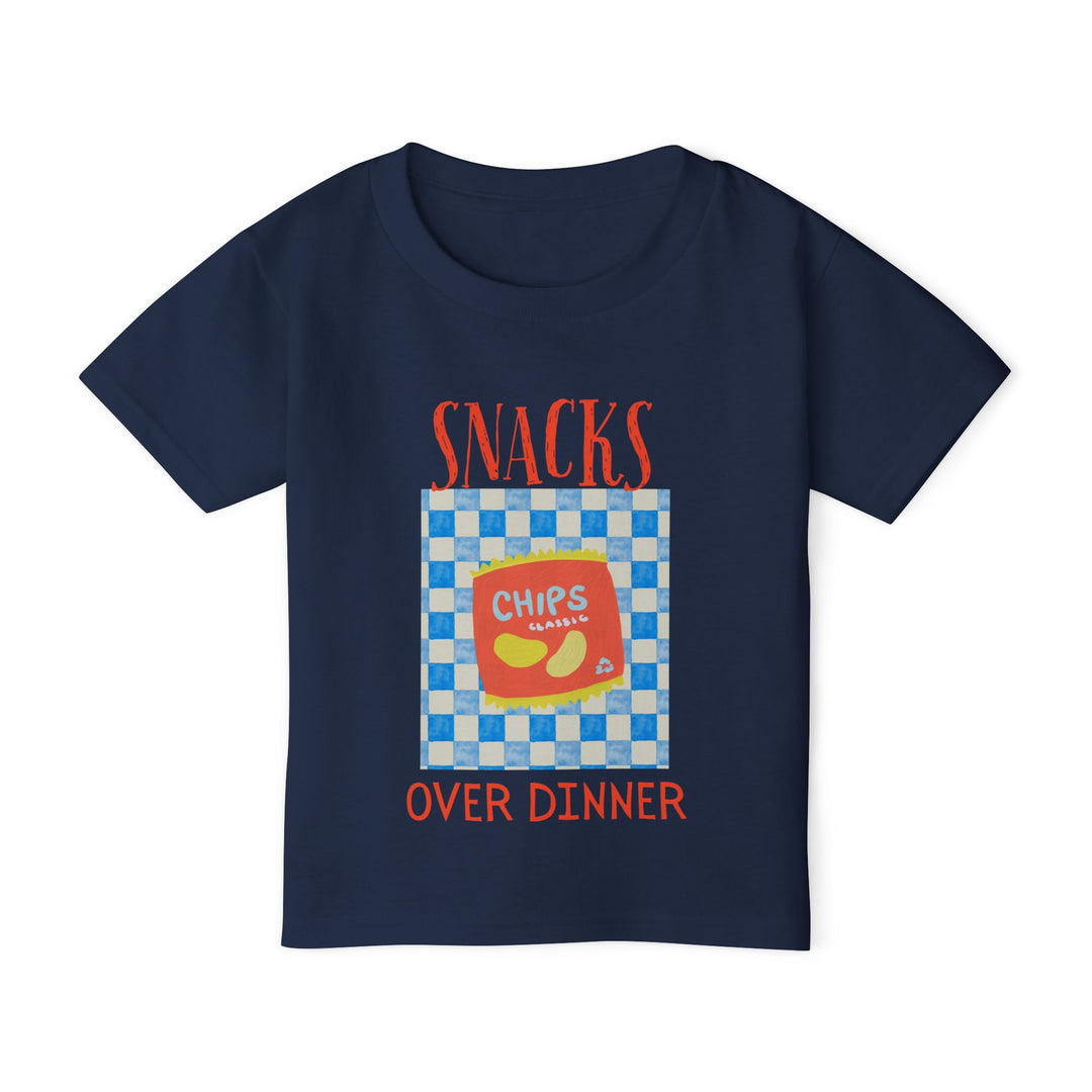 Heavy Cotton™ Toddler T-shirt features a Chips Classic graphic, showcasing a vibrant chip bag with SNACKS OVER DINNER text, perfect for playful style.