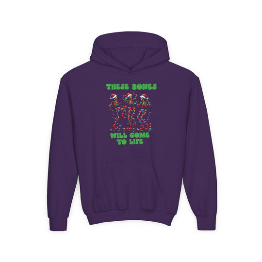 Bones Come to Life Youth Hoodie: Purple hoodie with dancing skeletons in Santa hats, adorned with Christmas lights and green text. Made of soft, preshrunk fleece.