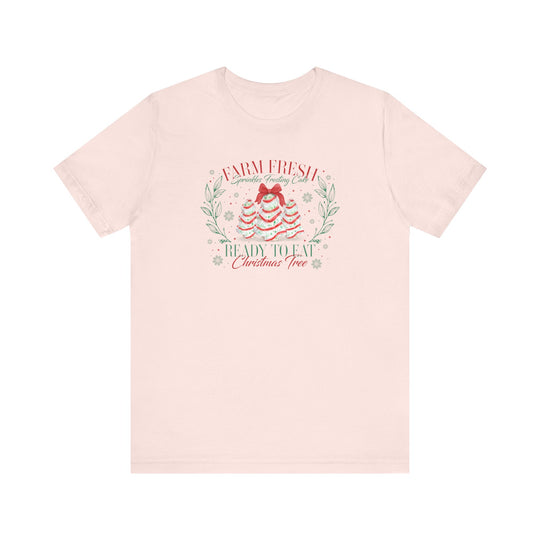 Farm Fresh Cookies Tee with festive cake design resembling Christmas trees, featuring snowflakes and wording. Classic unisex fit, soft cotton, and ribbed collars for lasting shape.