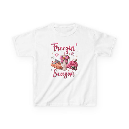 Freezin Season Kids Tee features a colorful embroidered graphic with winter items like slippers and a beanie, perfect for cozy, everyday wear.