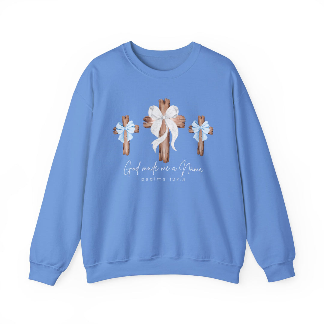 Light-blue crewneck sweatshirt featuring rustic wooden crosses with bows and 'God made me a Nana, Psalms 127:3' script, ideal for comfort and style.