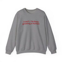 Heather-gray crewneck sweatshirt with bold red text, I can’t. i’m busy growing a human. Comfortable unisex fit from Faith Family Designs.