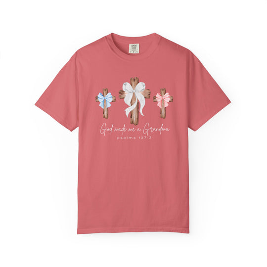 Coral T-shirt with rustic wooden crosses and bows, featuring God made me a Grandma and Psalms 127:3. Comfortable, durable, relaxed fit from Faith Family Designs.