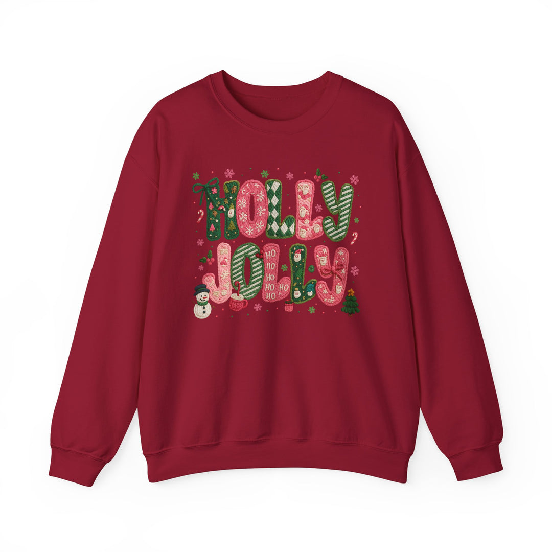 Red Holly Jolly Crew sweatshirt features festive knitted-style lettering with holiday motifs including snowflakes, holly, Santas, a snowman, and a Christmas tree.