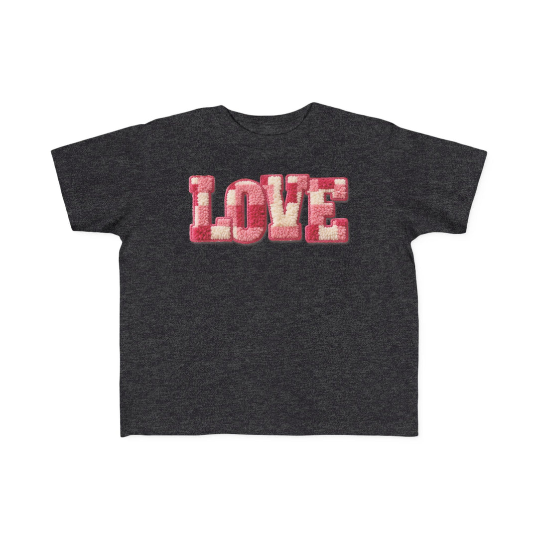 Love Toddler Tee featuring LOVE in fluffy pink and off-white chenille letters on a dark charcoal-grey, short-sleeved shirt, perfect for toddlers' sensitive skin.
