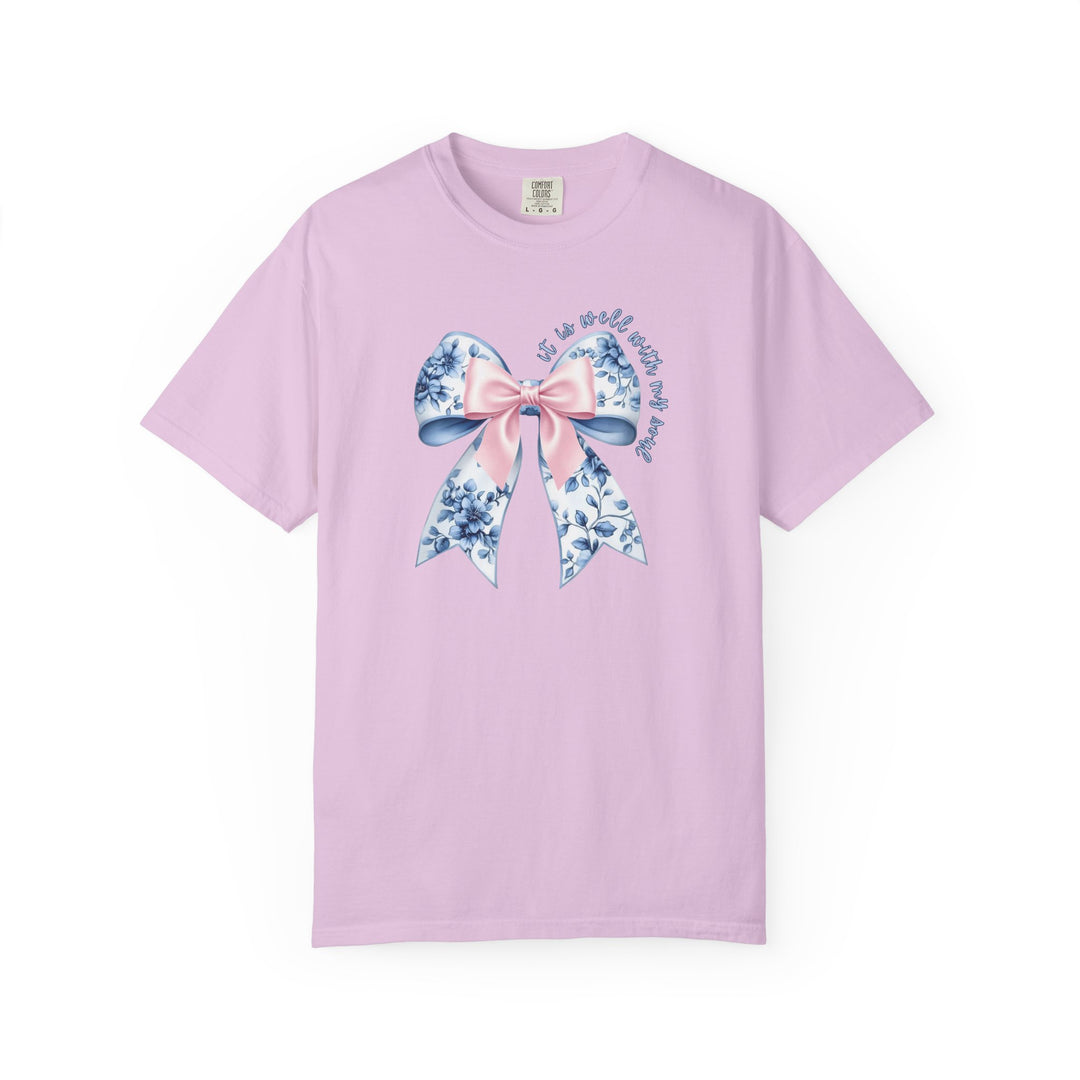 It is Well With My Soul Tee featuring a decorative bow with floral pattern and inspiring quote, offering luxurious comfort and style in various sizes.