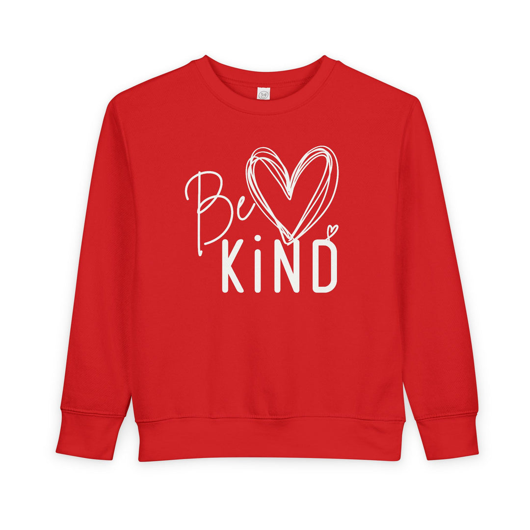 Red Be Kind Toddler Crew sweatshirt with a white heart and text, designed for comfort and durability with a soft cotton-polyester blend.