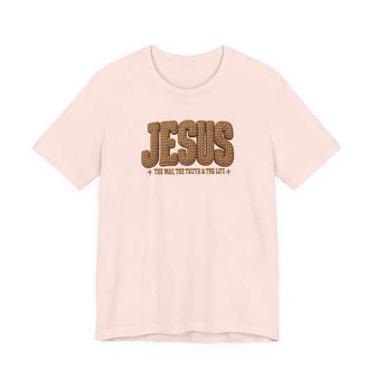 Jesus Tee: Light-colored short-sleeve T-shirt featuring JESUS in rope-textured brown font and + THE WAY, THE TRUTH & THE LIFE + below.