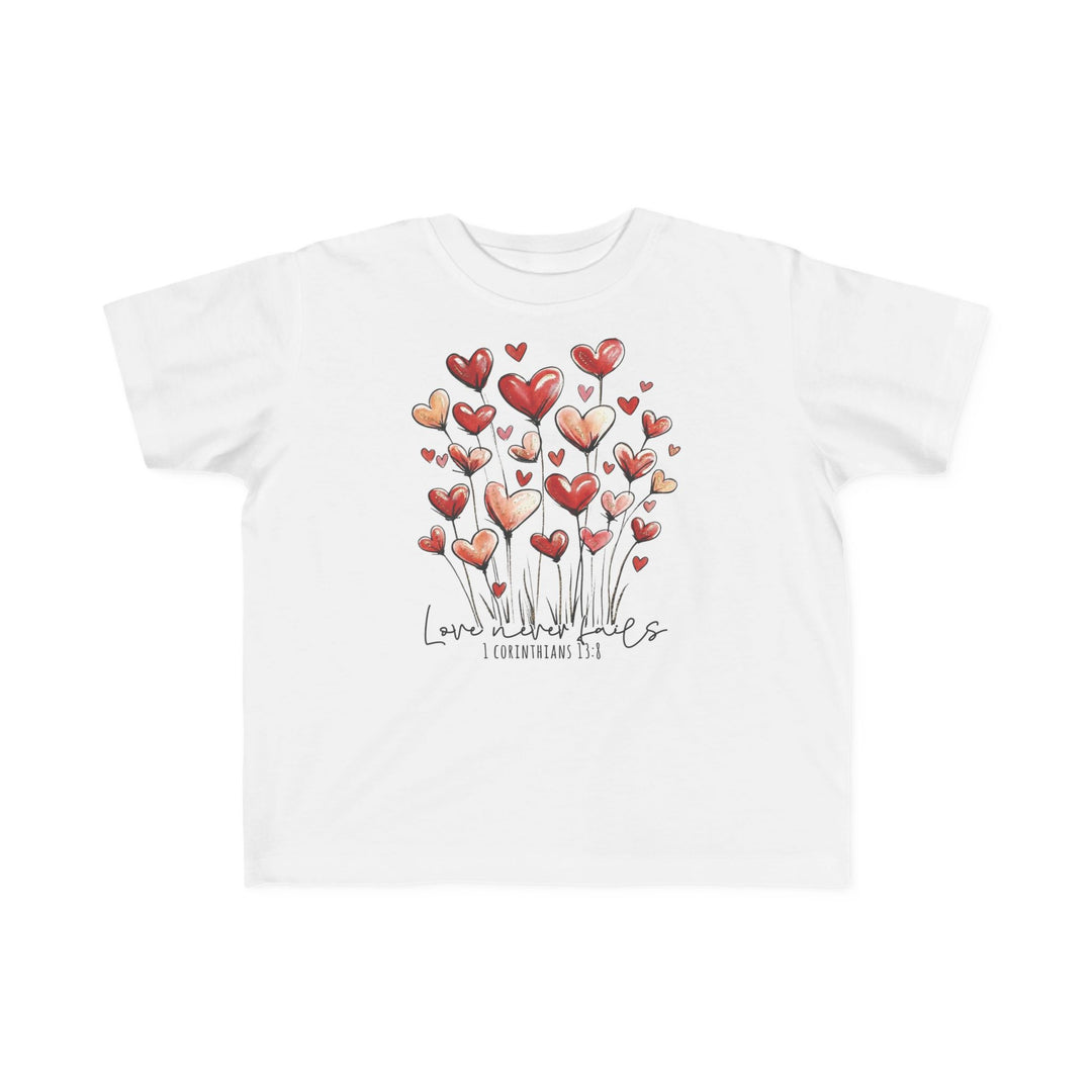 Love Never Fails Toddler Tee features heart-shaped flowers and Love never fails with 1 Corinthians 13:8, perfect for a toddler's sensitive skin.