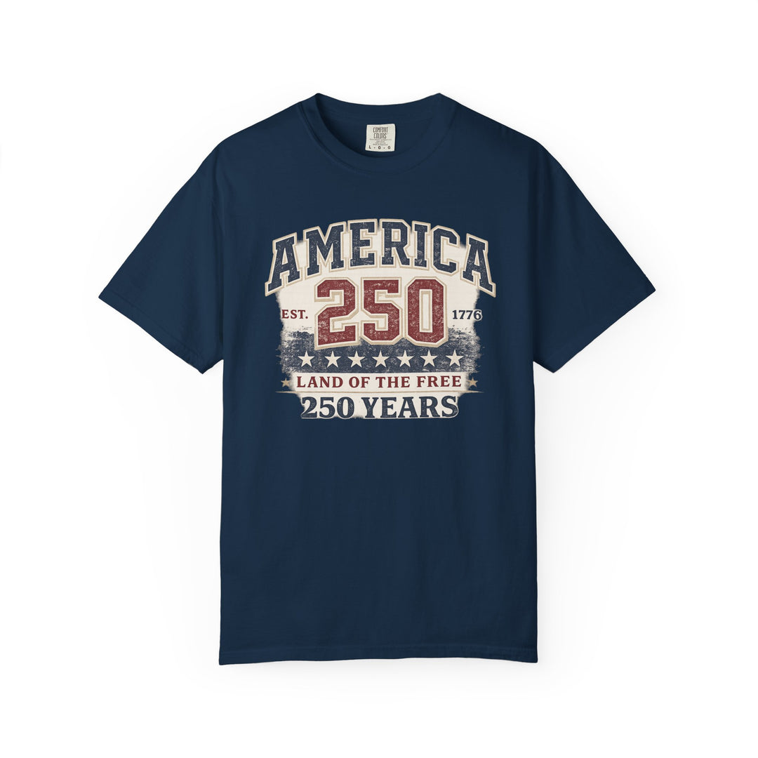 Navy-blue America 250 Years Tee with vintage patriotic graphics, celebrates 250 years with AMERICA, Est. 1776, and LAND OF THE FREE slogans on front.