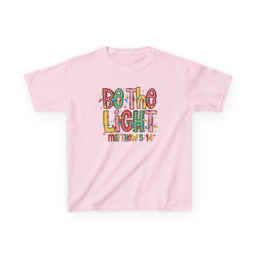 Be the Light Kids Tee featuring a festive slogan with Christmas-style lights and Bible reference, laid flat to showcase its design.