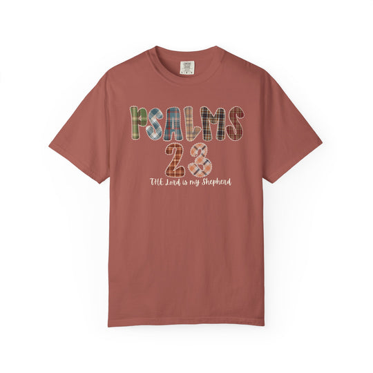 Rust-colored Psalms 23 T-shirt with patchwork-style text and cursive script The Lord is my Shepherd, offering a relaxed fit for comfort.