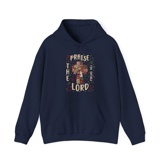 Praise the Lord Hoodie with patchwork cross, festive bow, stars, and Psalms 106:1 text on navy-blue, offering warmth and style for chilly days.