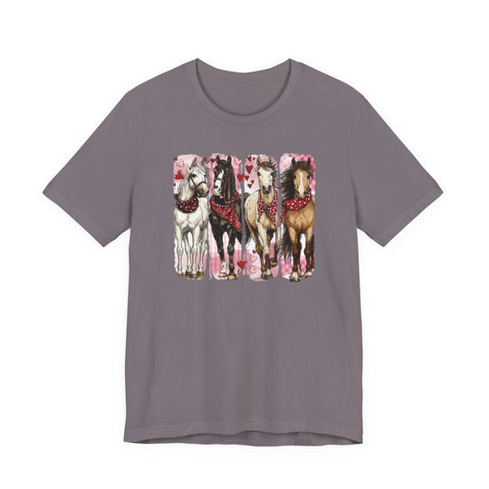 Horse Valentine Tee featuring four illustrated horses with heart-patterned bandanas on a muted mauve-gray backdrop, embodying a love-of-horses theme. Soft cotton, unisex fit.