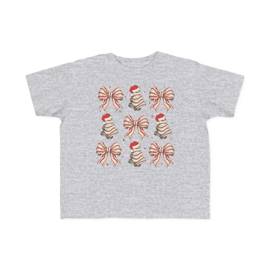 Cookies and Bows Toddler Tee with festive icons of bows and Christmas trees, perfect softness for toddlers, durable print, available in toddler sizes.