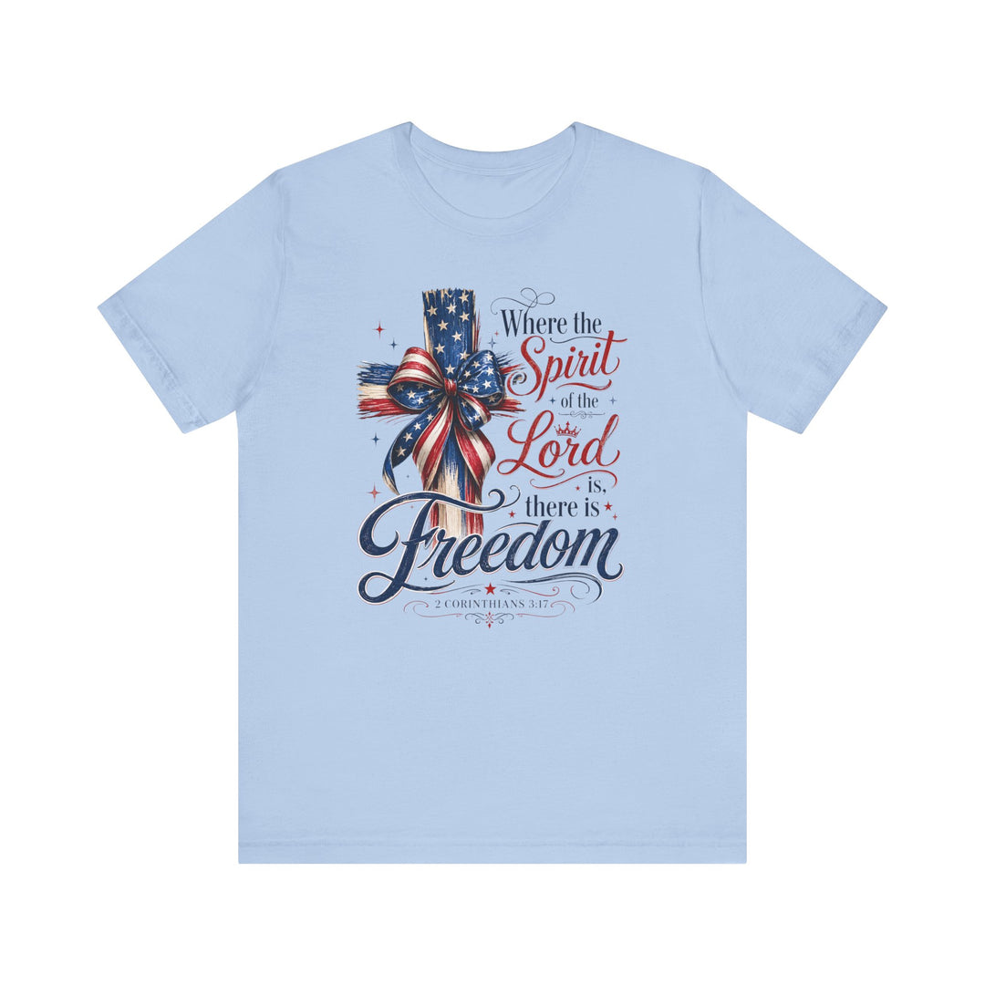 Spirit of the Lord Tee showcasing a cross wrapped in stars-and-stripes ribbon, featuring 2 Corinthians 3:17. Made of soft cotton with a retail fit.