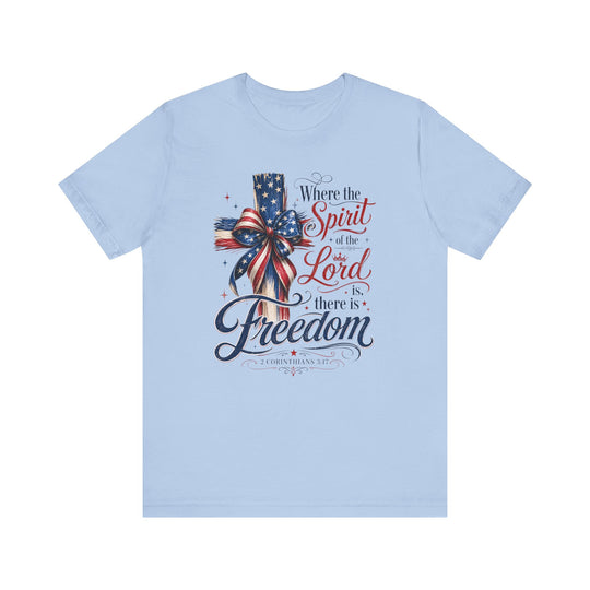 Spirit of the Lord Tee showcasing a cross wrapped in stars-and-stripes ribbon, featuring 2 Corinthians 3:17. Made of soft cotton with a retail fit.
