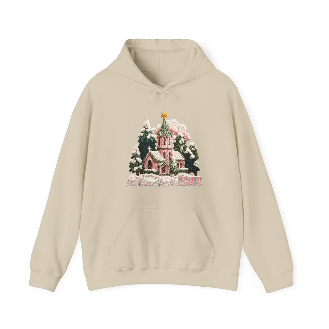 Gift is Jesus Hoodie featuring a vintage-style snow-covered church scene, evergreen trees, and The Greatest Gift Is JESUS script, with kangaroo pocket and color-matched drawstring.