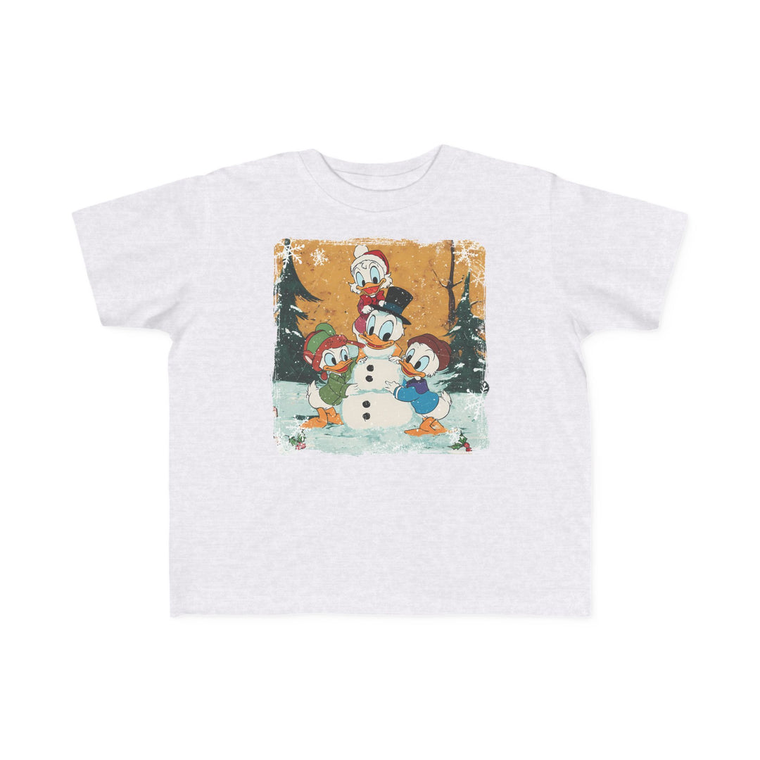 Duck Snowmen Toddler Tee featuring Donald Duck and nephews building a snowman in a snowy forest, perfect for toddlers with its soft, durable cotton fabric.