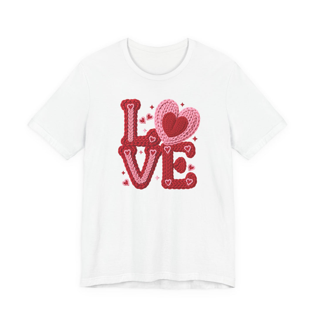 Love Heart Tee featuring a knitted-style LOVE graphic with pink and red shades and heart accents on a white background, perfect for casual, stylish wear.