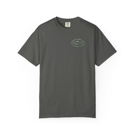 The image shows the It's Fish O'clock Somewhere Tee, a relaxed-fit, durable, garment-dyed t-shirt made of 100% ring-spun cotton, ideal for casual wear.