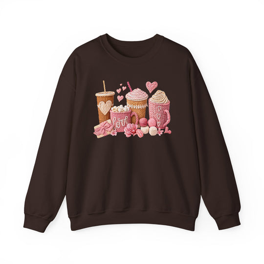 Coffee Love Crew sweatshirt with a knitted-style illustration of hot drink vessels, hearts, yarn, and flowers. Made from cotton-poly blend, offering comfort and durability.