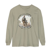 A Faith Family Hunting long-sleeve t-shirt featuring a man and child walking in a field. Made of 100% ring-spun cotton with a relaxed fit for comfort. Ideal for casual wear.