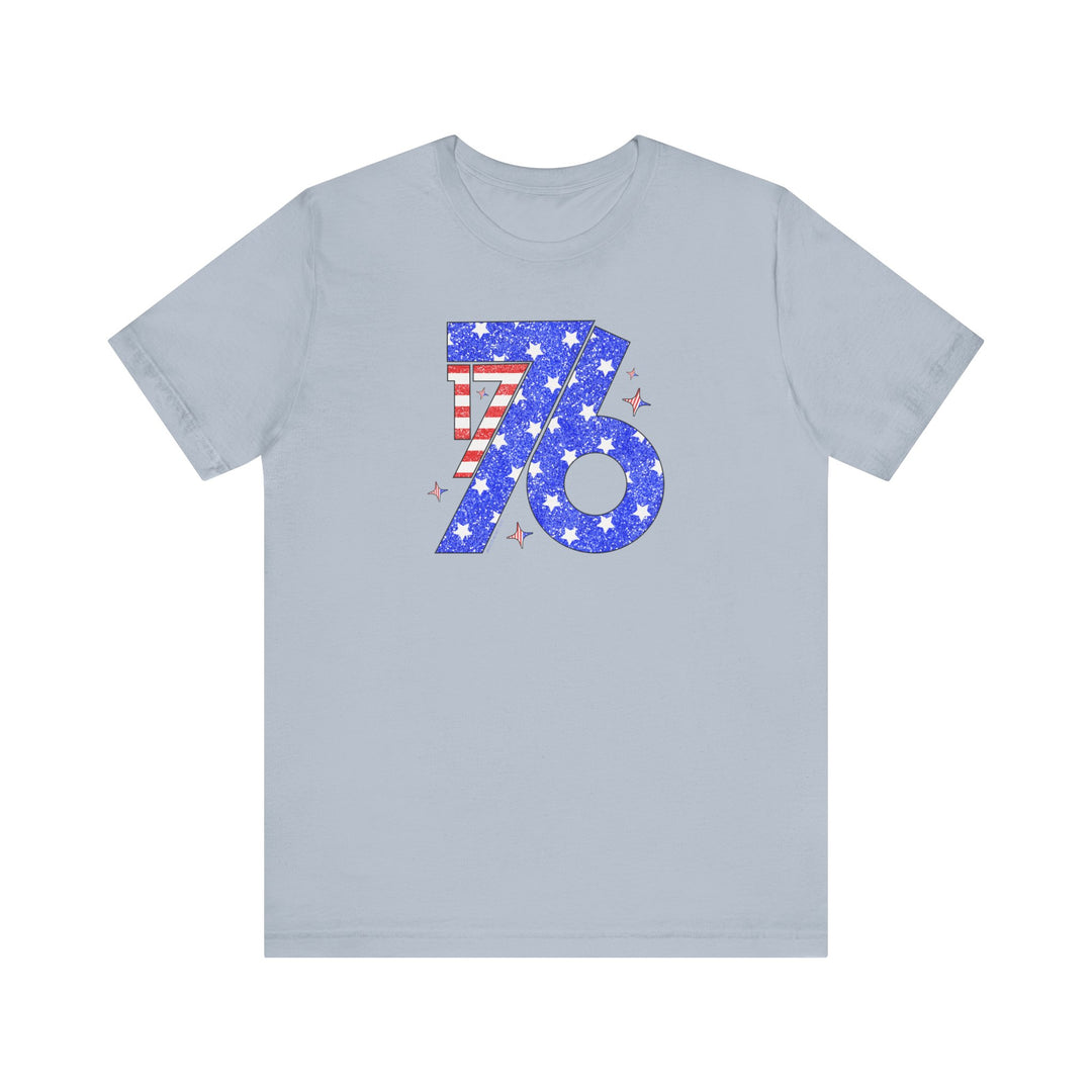 A grey t-shirt featuring a red and white striped number with stars, embodying the 1776 Tee style from Worlds Worst Tees. Unisex jersey tee made of 100% Airlume combed cotton, with ribbed knit collars and tear-away label.