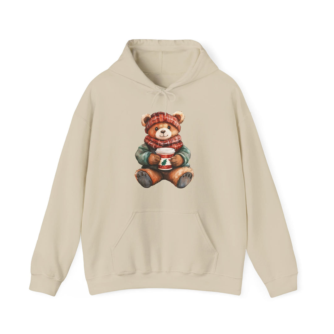 Old Money Bear Hoodie with a teddy bear graphic in winter attire, featuring a red-plaid hat and scarf, holding a festive cup. Cozy cotton-polyester blend.